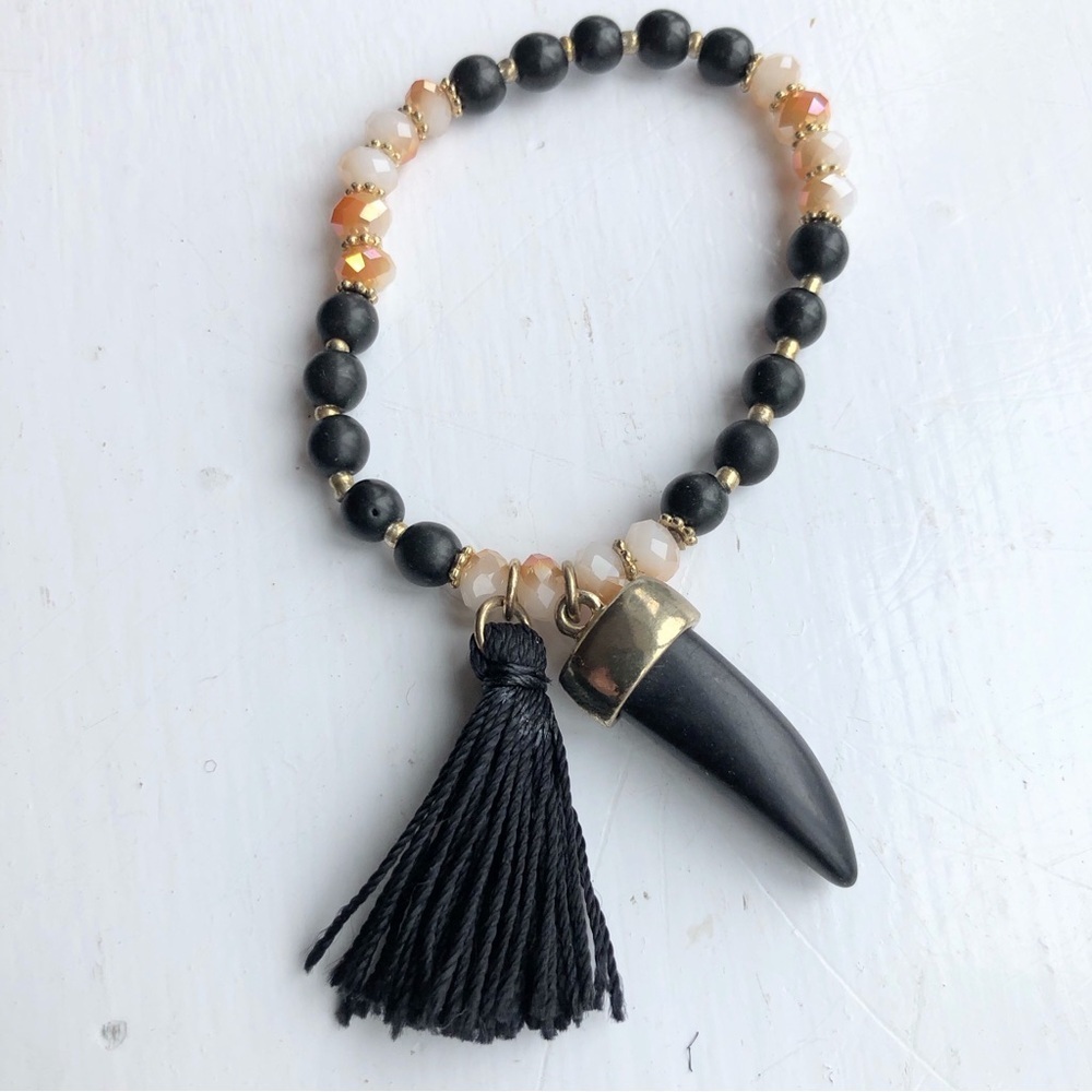 earthy neutral beaded horn tassel stretch bracelet